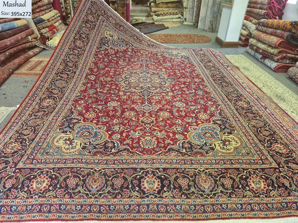 Antique hand knotted Mashhad Persian carpet
